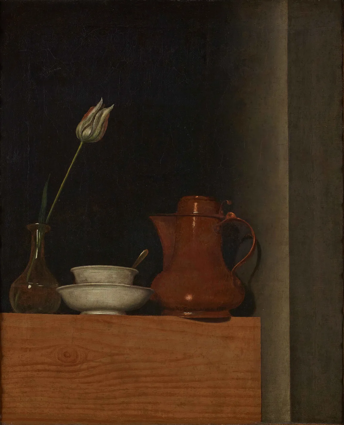 A brown Jug, glass vase with white flower and white porcelain dish on a wooden cupboard. 