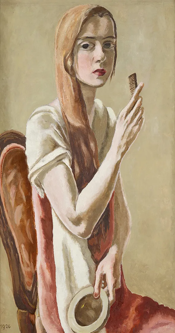Young woman with light red hair holding a comb.